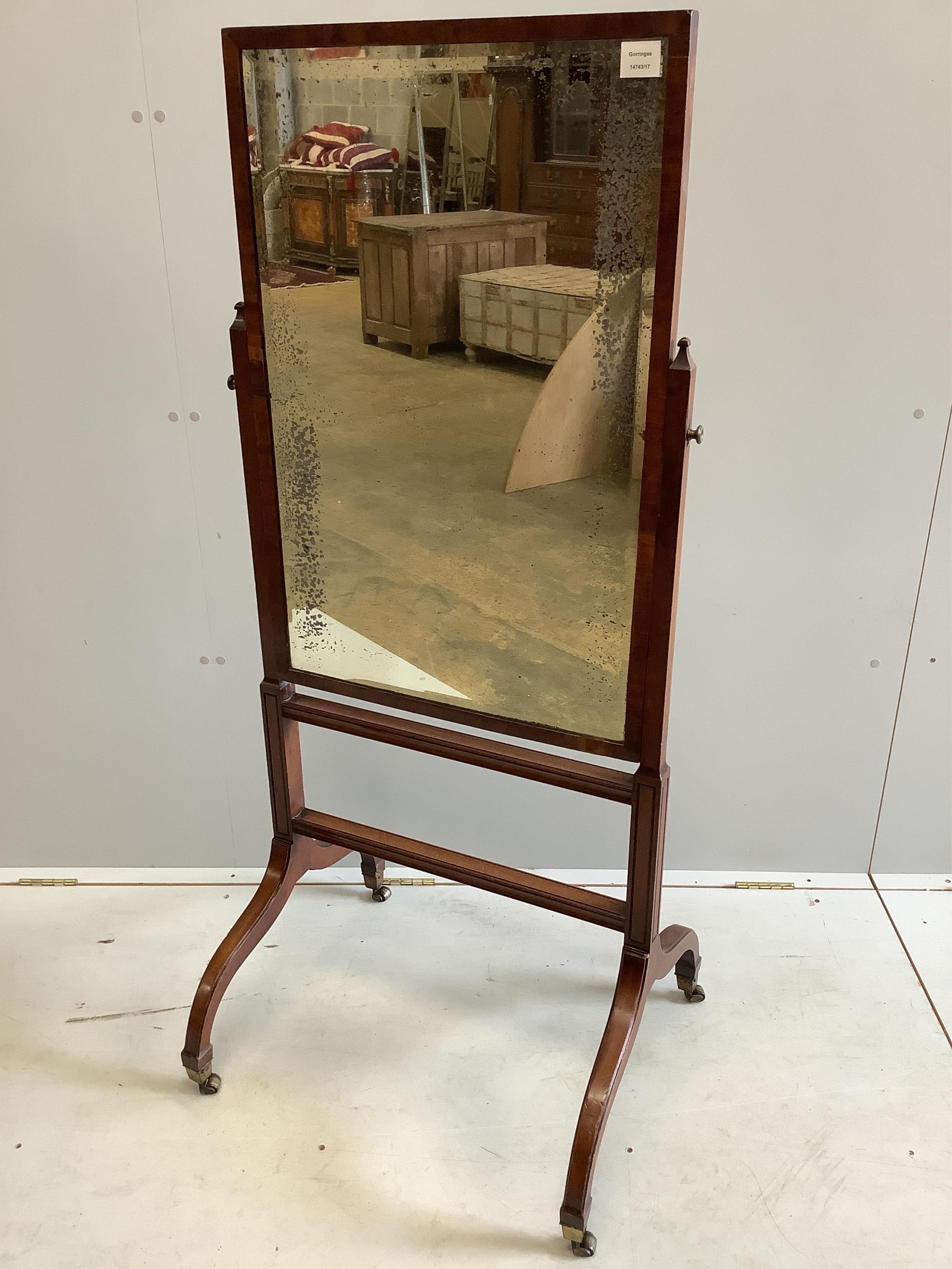 A Sheraton style mahogany cheval mirror, width 62cm, height 143cm. Condition - fair
